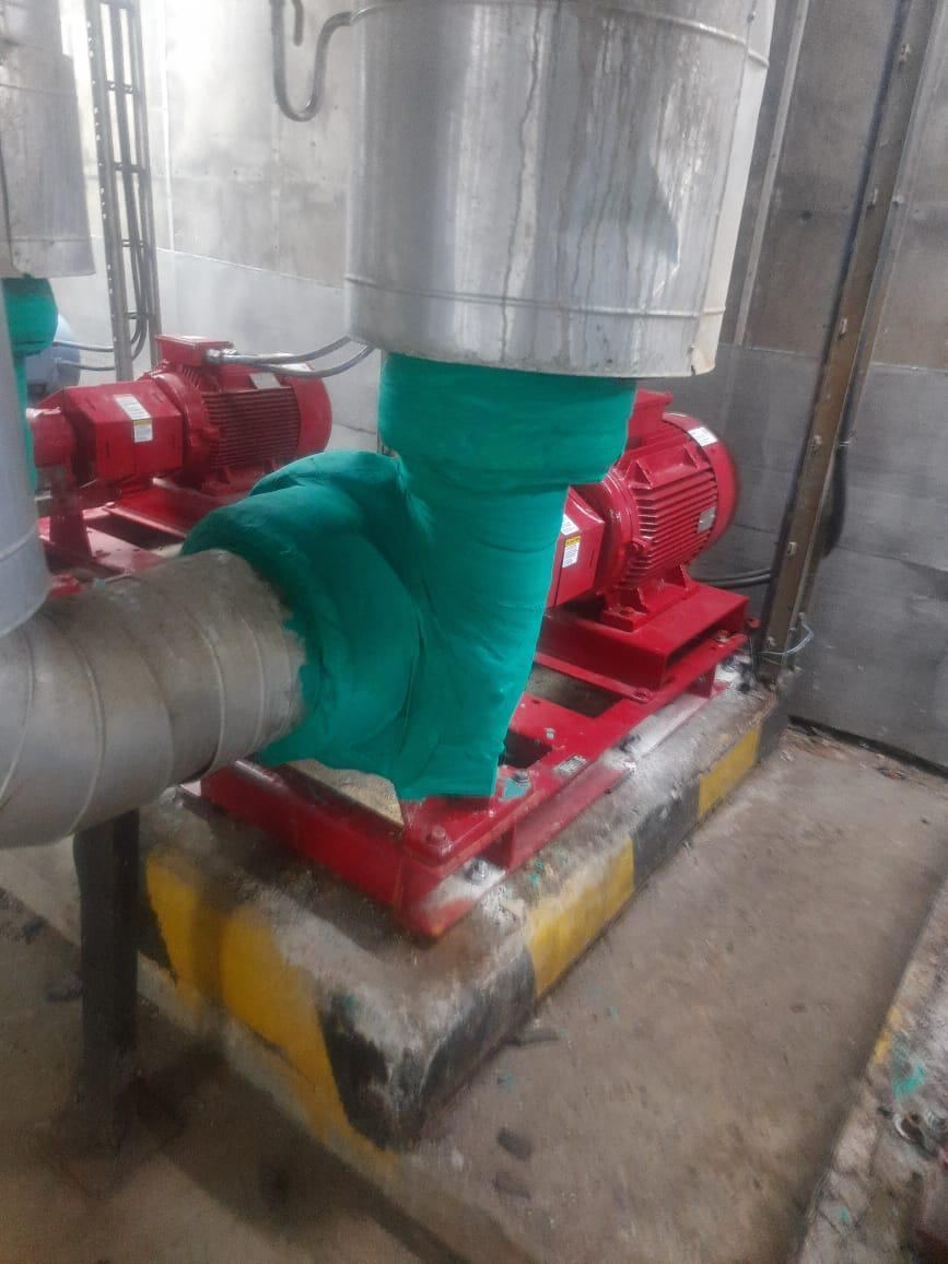 Chilled water circulating pump replacement with insulation wrap on a rooftop plant